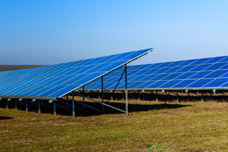 Many solar panels in field. Clean energy. Ecological concept