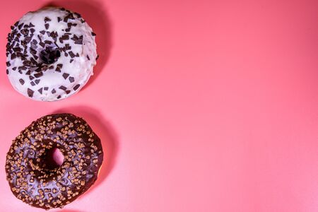 Fresh glazed donuts isolated on pink backgroundの写真素材