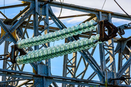 High voltage power line. Closeup of ceramic insulatorの写真素材