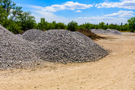 Big piles of the rubble near roadsideの写真素材
