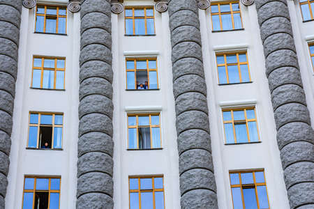 Kiev, Ukraine - August 23, 2019: Ukrainian officials and ministers in windows of the cabinet of ministers during the celebration of Day of State Flag of Ukraineのeditorial素材