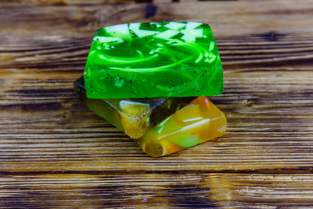 Pieces of handmade soap on wooden backgroundの写真素材
