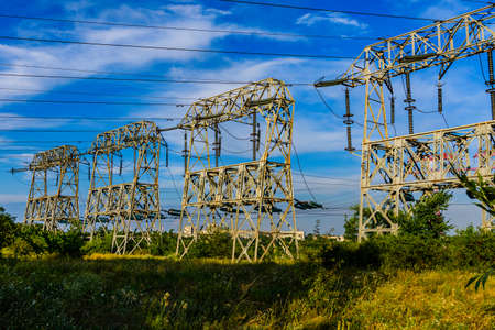 High voltage power line against blue skyの写真素材