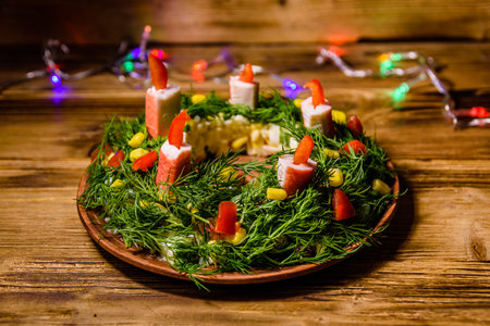 Festive salad in shape of Christmas wreath. Christmas and new year celebrationの写真素材