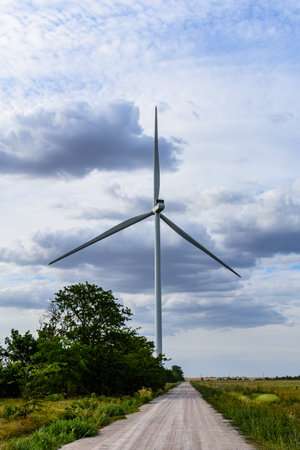 Wind turbine at agricultural field. Clean energy. Ecological concept