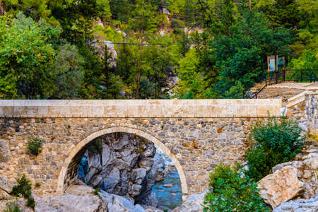 Old stone bridge across river in canyon not far from city Kemer. Antalya province, Turkeyの写真素材