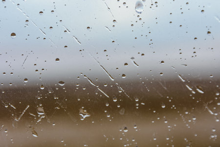Water drops on car glass. Raining weather