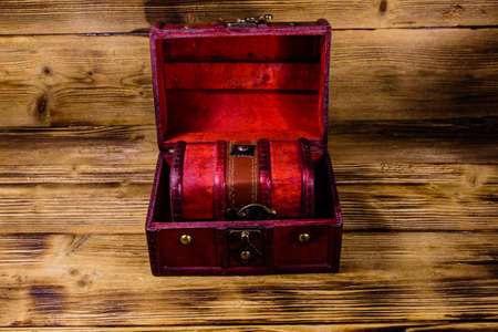 Vintage chest from red wood on rustic wooden backgroundの写真素材