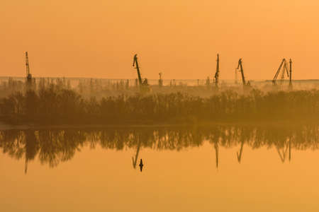 Heavy cranes at cargo port in Kremenchug, Ukraineの写真素材