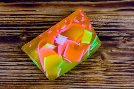 Piece of handmade soap on wooden background. Top viewの写真素材