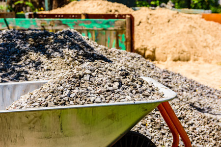 Wheelbarrow full of rubble at construction site