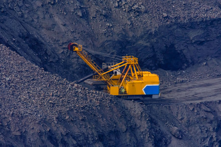 Heavy excavator working in the iron ore quarryの写真素材