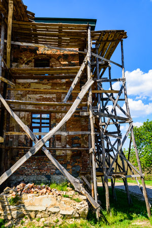 Wooden scaffolding near old building. Ancient building restorationの写真素材