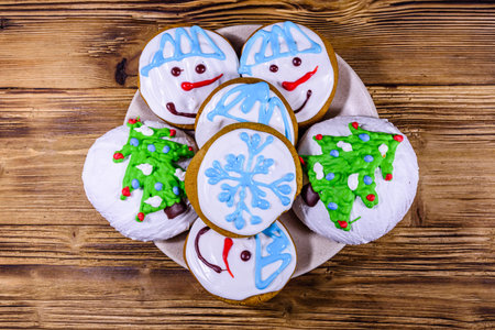 Christmas gingerbread cookies on a wooden table. Top view