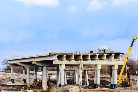 Construction of new overpass above the roadの写真素材