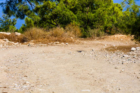 Dirt road in mountains on summer dayの写真素材