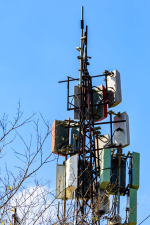 Telecommunication antennas and wireless communication antenna transmitter against blue sky