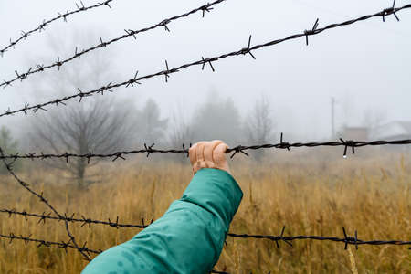 Barbed wire fence at Chernobyl exclusion zone, Ukraineの写真素材