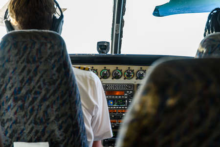 View from rear seats of control panel of small propeller airplaneの写真素材