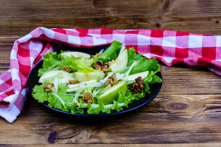 Plate waldorf salad on wooden tableの写真素材