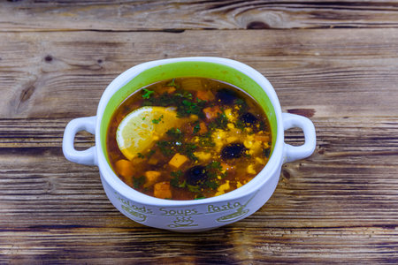 Russian traditional hodgepodge soup on wooden tableの写真素材
