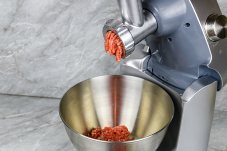Making ground meat in modern food processor with meat grinderの写真素材
