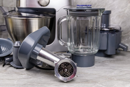 Modern kitchen machine with various accessories. food processor