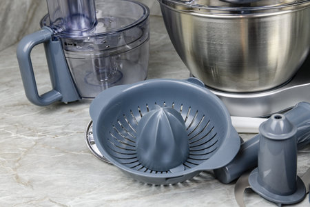 Modern kitchen machine with various accessories. food processor