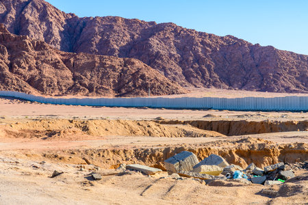 View of mountains at Sinai peninsula in Egypt. Protective wall around the city Sharm el Sheikhの写真素材