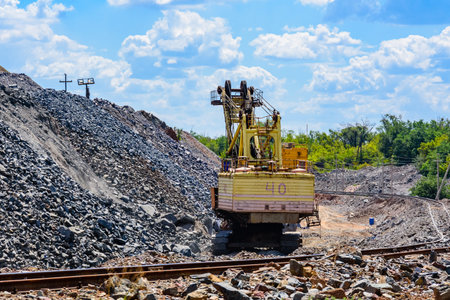 Heavy excavator working in the iron ore quarry