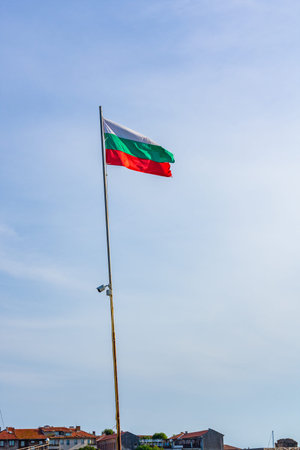 Bulgarian national flag waving in blue sky