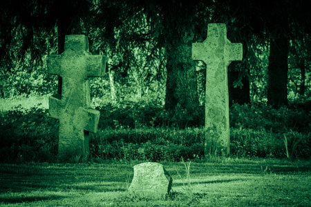 Old stone crosses at ancient cemetery. Abandoned graveyardの写真素材