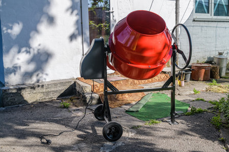 Red concrete mixer. Construction equipment. Construction siteの写真素材