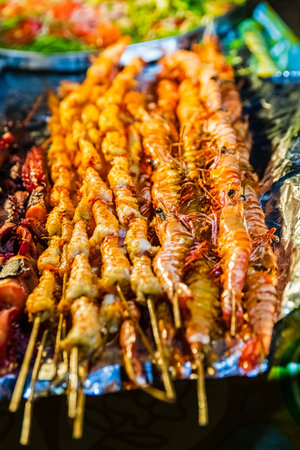 Different seafood for sale at Forodhani gardens in Stone town at night. Zanzibar, Tanzaniaの写真素材