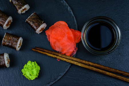 Sushi maki roll with tuna on slate board. Japanese food. Top viewの写真素材