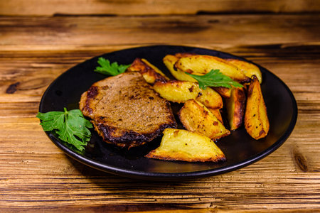 Roasted beefsteak with fried potato and parsleyの写真素材