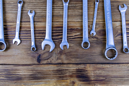 Set of spanners on the wooden background. Top view