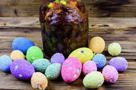Traditional easter bread and easter eggs on wooden background