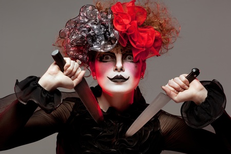 woman mime with knifeの写真素材