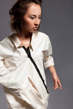 Modern fashionable woman over grayの写真素材