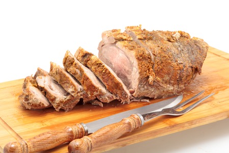 Cold baked pork. Closeup on Cutting Board.の写真素材