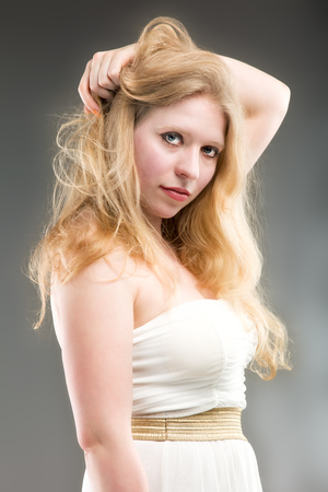 Head and shoulders of a gorgeous woman at greyの写真素材