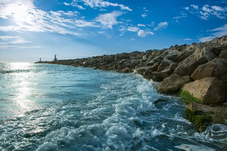 Bay on the coast at France with large rocks as a breakwater on the Mediterranean Seaの写真素材