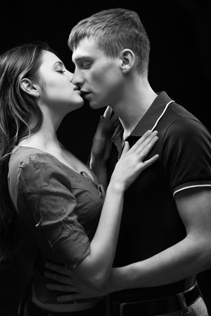 Monochrome studio portrait of a passionate coupleの写真素材