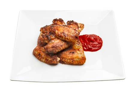 Plate of delicious barbecue chicken wingsの写真素材