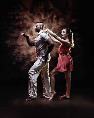 Young and sexy couple dances Caribbean Salsaの写真素材