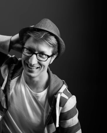 Young mans portrait. Close-up face against gray backgroundの写真素材