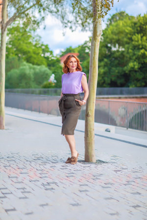 Beautiful successful middle aged woman posing on the street photo shootの写真素材