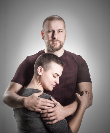 Portrait of attractive cute cheerful couple cuddling,の写真素材