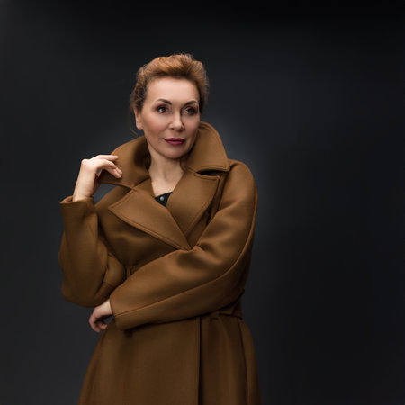 Timeless Elegance in a Luxurious Brown Coatの写真素材